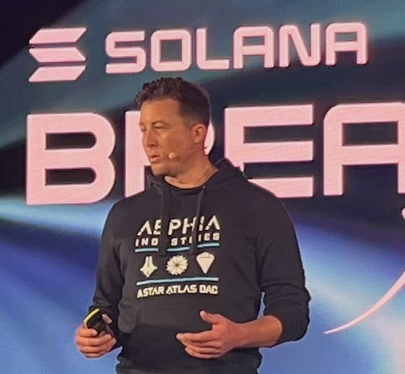Michael Wagner on stage at Solana Breakpoint, wearing an Aephia Industries hoodie