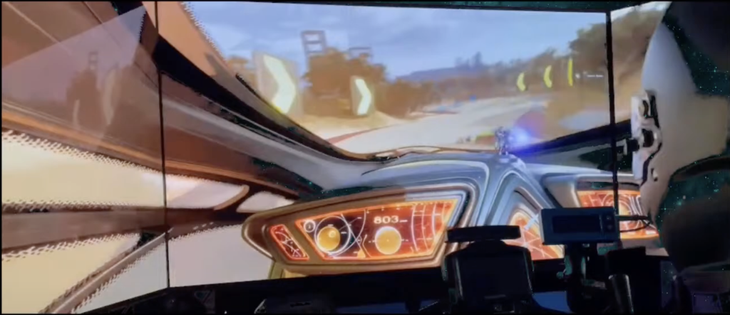 Team member racing on a 3-monitor setup (December 2023)