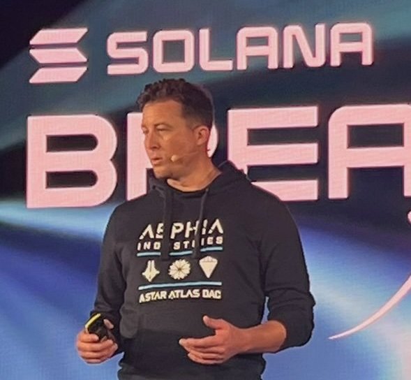 Michael Wagner on stage at Solana Breakpoint, wearing an Aephia Industries hoodie